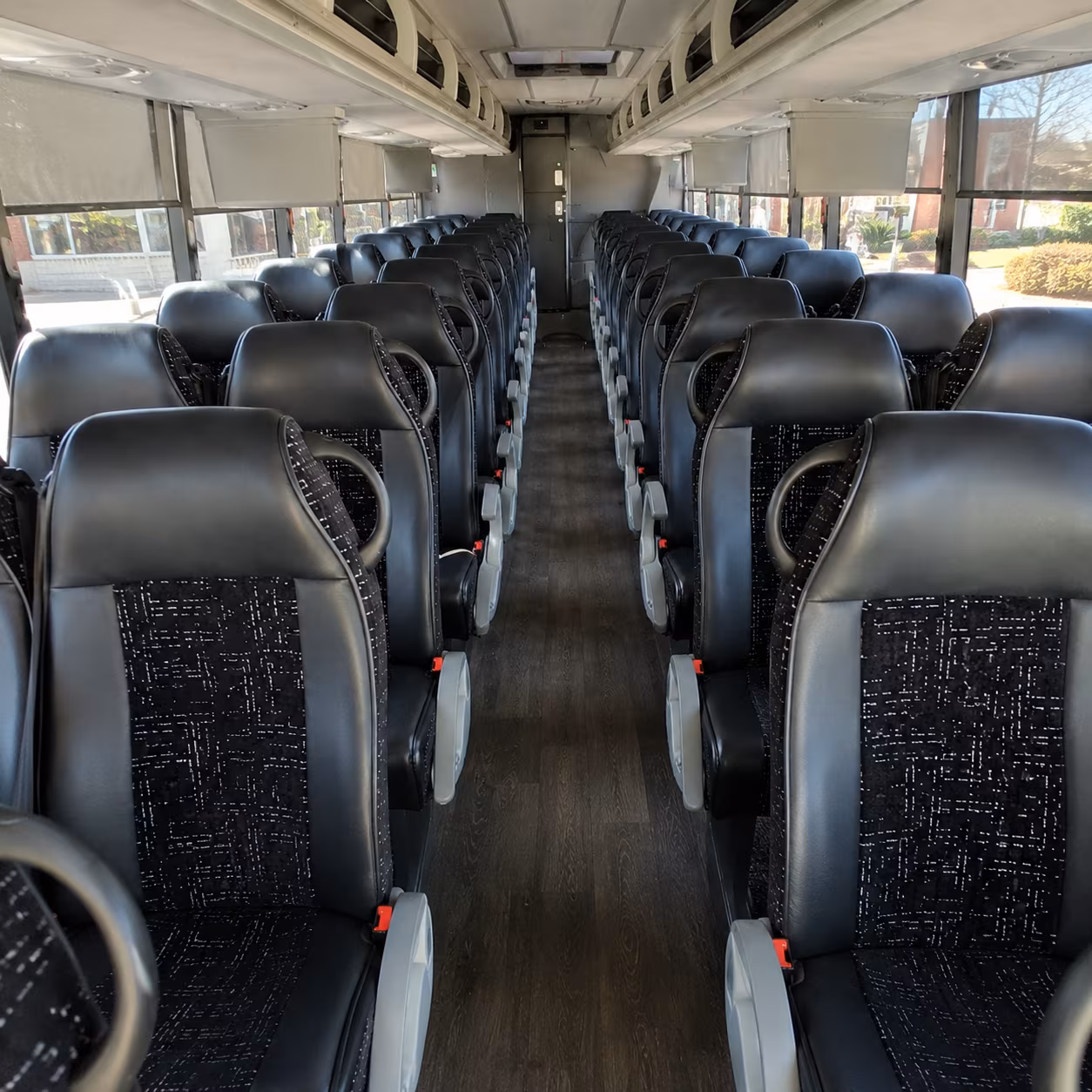 reading 54 passenger charter bus inside